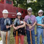Our team holding their groundbreaking ceremony shovels.